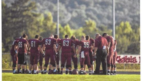 This photo, which shows Chestatee High School football players praying, was one of several that triggered complaints from the American Humanist Association. (The Times, Gainesville)
