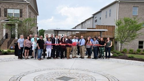 A ribbon-cutting ceremony was held recently by Kennesaw city officials and students from the Kennesaw State University Master Craftsman Program for a sign, shade structure and sundial designed and crafted by the students for the city. (Courtesy of Kennesaw)