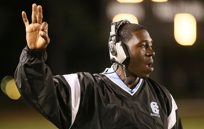  Cedar Grove's head coach Jermaine Smith signals his players. (Phil Skinner/Special to AJC)