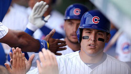 Chicago Cubs first baseman Anthony Rizzo is greeted in the dugout after scoring against the Chicago White Sox on July 25, 2017, at Wrigley Field in Chicago. (Brian Cassella/Chicago Tribune/TNS)