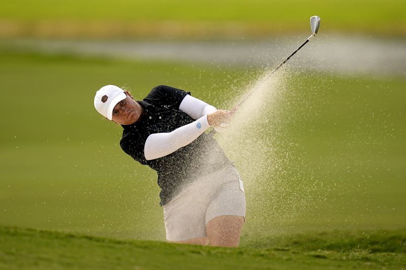 Lauren Coughlin hits from the fifth fairway bunker during the first round of the Chevron Championship LPGA golf tournament Thursday, April 18, 2024, at The Club at Carlton Woods, in The Woodlands, Texas. (AP Photo/Eric Gay)