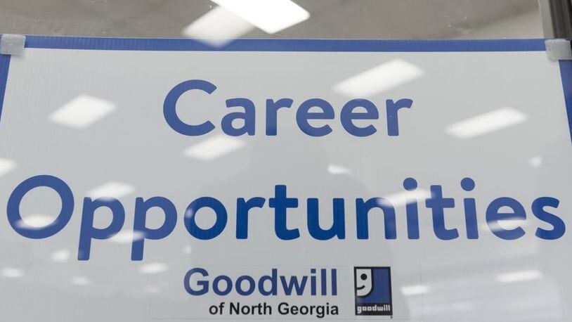 A sign in the window of the Goodwill of North Georgia’s career center in Oakwood, Georgia, in 2017. (DAVID BARNES / DAVID.BARNES@AJC.COM)