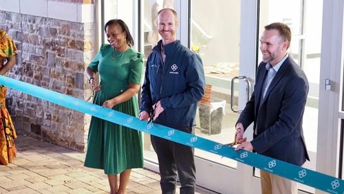 From left to right: Mayor Beverly Burks of Clarkston, CEO of Ethne Health Dr. Robert Contino and Send Relief's Joshua Benton. The trio cut the ribbon at the opening of Ethne Health's new location on Saturday, November 12, 2022.