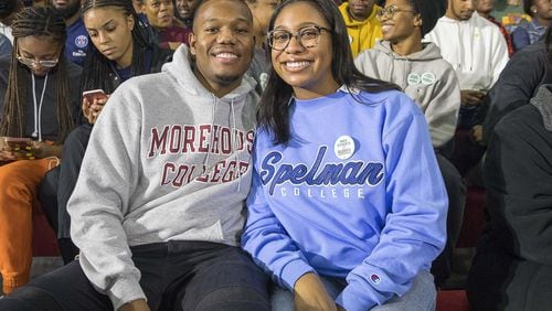 Morehouse College senior Phil Edwards (left) and his girlfriend Spelman College senior Sydney Pascal (right) pose for a photo before the start of an Elizabeth Warren campaign stop at Clark Atlanta University in Atlanta, Thursday, November 21, 2019. ALYSSA POINTER/AJC
