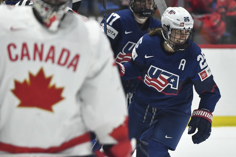 United States forward Alex Carpenter (25) celebrates after scoring against Canada during the second period in the final at the women's world hockey championships in Utica, N.Y., Sunday, April 14, 2024. (AP Photo/Adrian Kraus)