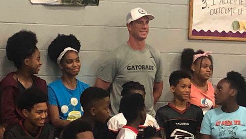 Falcons quarterback Matt Ryan posing with students at the Samuel Jones Boys and Girls Club of Metro Atlanta on Thursday. (By D. Orlando Ledbetter/dledbetter@ajc.com)