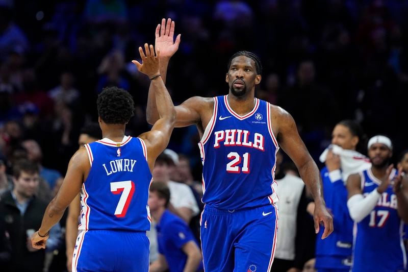 Philadelphia 76ers' Joel Embiid, right, and Kyle Lowry celebrate during the second half of an NBA basketball game against the Oklahoma City Thunder, Tuesday, April 2, 2024, in Philadelphia. (AP Photo/Matt Slocum)