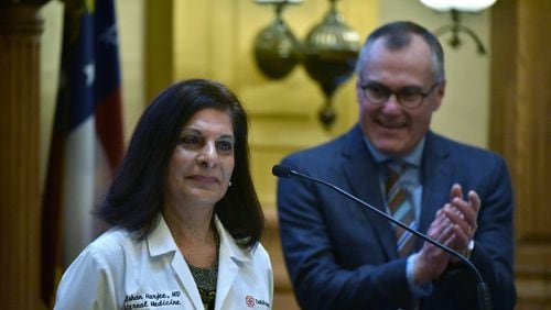 Gulshan Harjee, who grew up in Tanzania, speaks to the Georgia Senate in January as Lt. Gov. Casey Cagle (background) looks on. She graduated from Morehouse School of Medicine. HYOSUB SHIN / HSHIN@AJC.COM