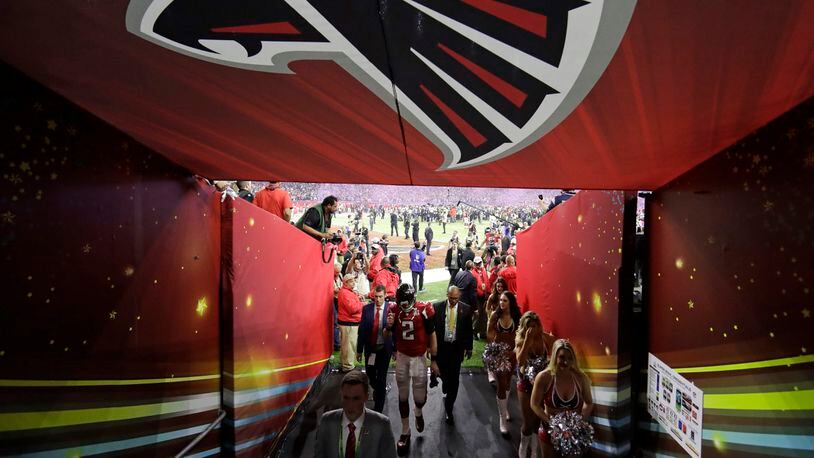Atlanta Falcons' Matt Ryan walks back to the locker room after the 34-28 overtime loss to the New England Patriots in the Super Bowl Sunday, Feb. 5, 2017, in Houston.