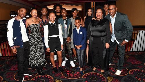 The Oct. 3 Atlanta screening of “The Hate U Give” brought out the film’s stars, as well as Mayor Keisha Lance Bottoms (back, center), author Angie Thomas (third from right) and director George Tillman Jr. (right). PARAS GRIFFIN / GETTY IMAGES