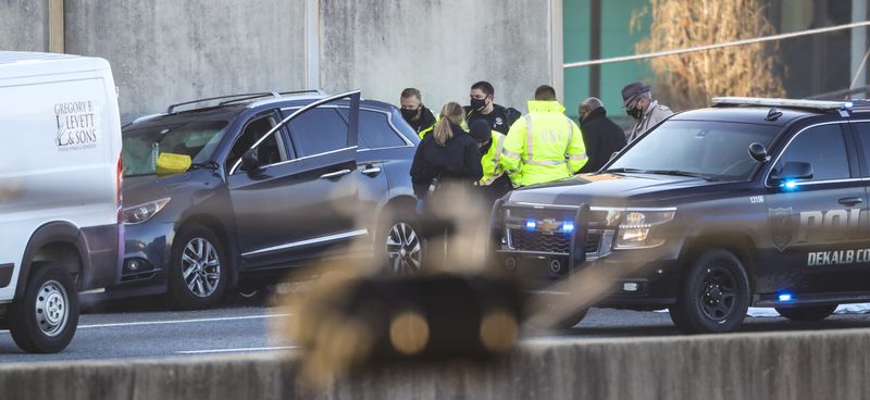 A man was shot to death inside a car on I-85 in DeKalb County on Jan. 21, 2021, prompting an investigation that closed the interstate for hours. (JOHN SPINK / John.Spink@ajc.com)

