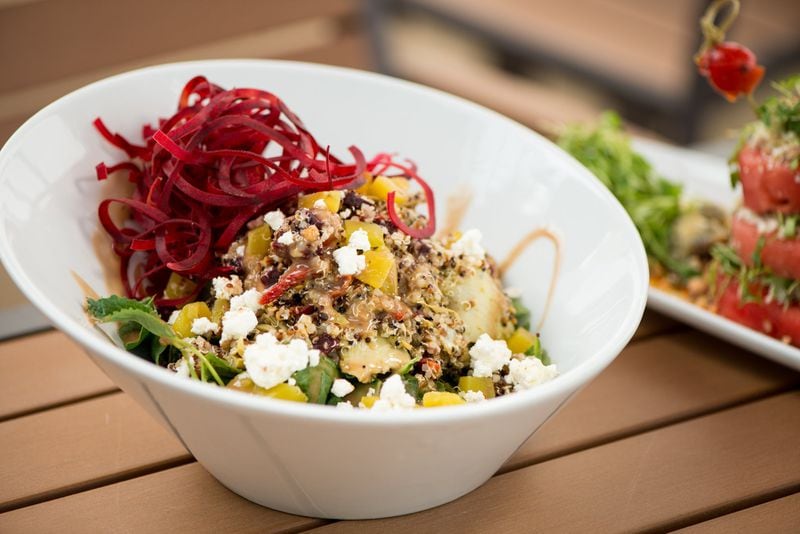  One of the new items at Sage Woodfire Tavern in Buckhead is a Roasted Beet and Baby Kale Quinoa Bowl with sun dried tomato, smoked almond, artichoke hearts, dates, goat cheese, mint, and chimichurri. Photo credit- Mia Yakel.