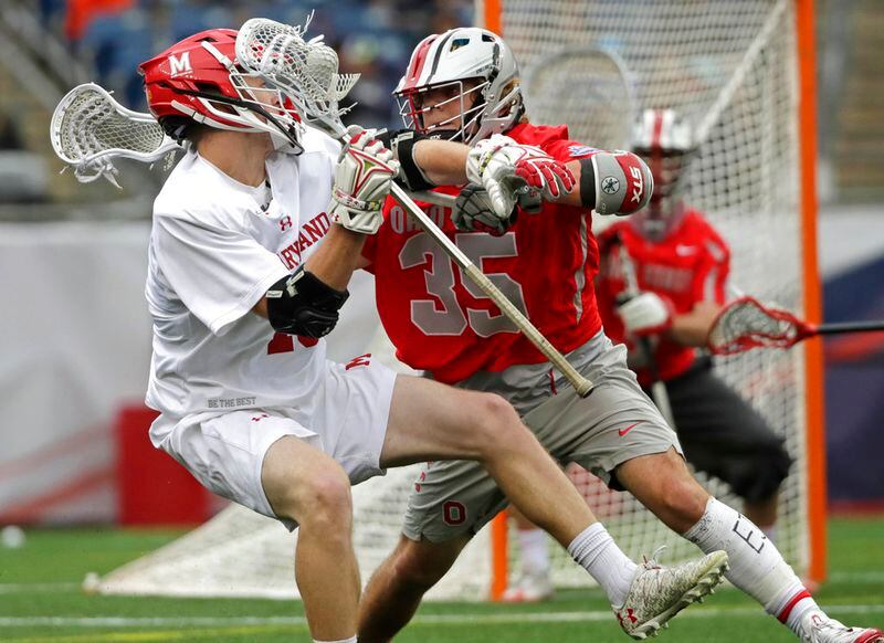 Maryland's Jared Bernhardt, left, attacks against Ohio State's Logan Maccani (35) during the first half of the NCAA college Division 1 lacrosse championship final, Monday, May 29, 2017, in Foxborough, Mass. (AP Photo/Elise Amendola)