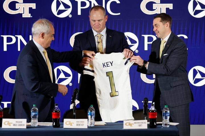 Georgia Tech President Ángel Cabrera and Director of Athletics J. Batt presented the jersey to the new football head coach Brent Key during a news conference on Monday, December 5, 2022. Miguel Martinez / miguel.martinezjimenez@ajc.com