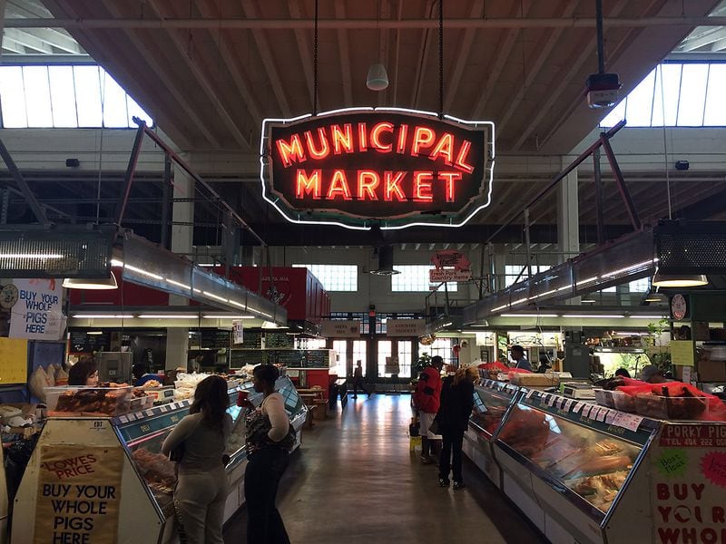 The Sweet Auburn Curb Market: Why is that main sign inside the building? Why does it say "Municipal Market"? And why is it on Edgewood Avenue and not Auburn? Here's the story: The market opened in 1924 as "The Municipal Market of Atlanta." By the estimate of current Director Pamela Joiner, it acquired its famous neon sign sometime in the 1940s or early '50s. During those years of segregation, black farmers and merchants were relegated to the outside of the building, and this secondary market became nicknamed the "curb market." In the 1990s the official name became "Sweet Auburn Curb Market," as a nod to the African-American business district one block over. Locals still use the nickname "Curb Market." (PETE CORSON / pcorson@ajc.com)