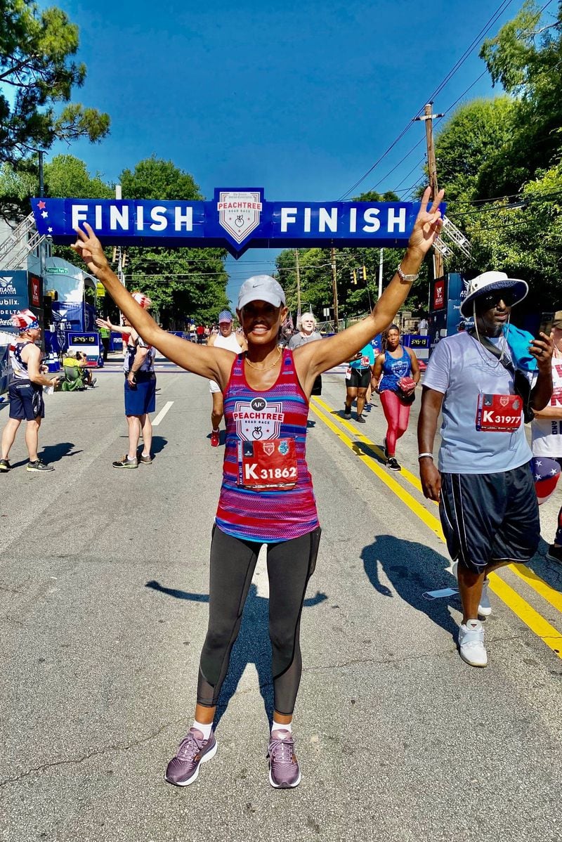 Lovette Russell completes The Atlanta Journal-Constitution Peachtree Road Race on July 4, 2021, just a few days after the second anniversary of her double lung transplant. Russell is battling scleroderma, an autoimmune disease that causes a tightening of the skin and connective tissue. (Courtesy of Lovette Russell)