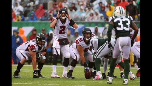 Quarterback Matt Ryan of the Atlanta Falcons at the line of scrimmage against the New York Jets. (Photo by Al Bello/Getty Images)