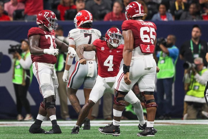 Alabama Crimson Tide quarterback Jalen Milroe (4) reacts after a touchdown against the Georgia Bulldogs during the first half of the SEC Championship football game at the Mercedes-Benz Stadium in Atlanta, on Saturday, December 2, 2023. (Jason Getz / Jason.Getz@ajc.com)