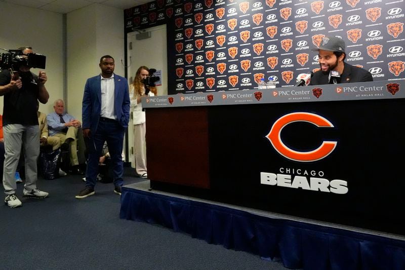Chicago Bears No. 1 draft pick quarterback Caleb Williams right, speaks during an NFL football news conference in Lake Forest, Ill., Friday, April 26, 2024. (AP Photo/Nam Y. Huh)