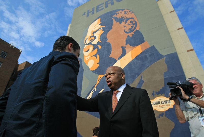John Lewis was honored again with the 2012 dedication of the colossal "HERO" mural in downtown Atlanta. The 65-foot tall painting by Sean Schwab, at the corner of Jesse Hill Jr. Drive and Auburn Avenue, made Lewis' face part of the city's skyline. (Jason Getz / AJC file)
