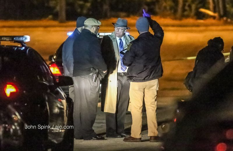 DeKalb County police are investigating a deadly home invasion. A man home with his two children wrestled with a masked intruder and shot him to death, police said. JOHN SPINK / JSPINK@AJC.COM