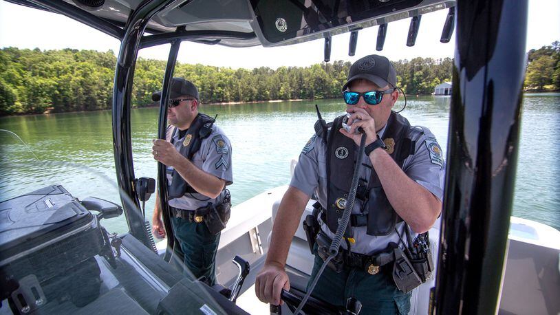 Game Warden Cpl. Dan Schay (left) and Game Warden 1st Class Kevin Goss head out on Lake Lanier for safety patrol on Friday, May 21, 2021.  (STEVE SCHAEFER for The Atlanta Journal-Constitution)