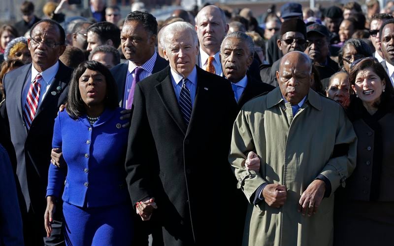 Vice President Joe Biden, center, leads a group across the Edmund Pettus Bridge in Selma, Ala., Sunday, March 3, 2013. They were commemorating the 48th anniversary of Bloody Sunday, when police officers beat marchers when they crossed the bridge on a march from Selma to Montgomery. From left: Selma Mayor George Evans, U.S. Rep. Terri Sewell, D-Ala., the Rev. Jesse Jackson, Biden, the Rev. Al Sharpton and U.S. Rep. John Lewis, D-Ga.