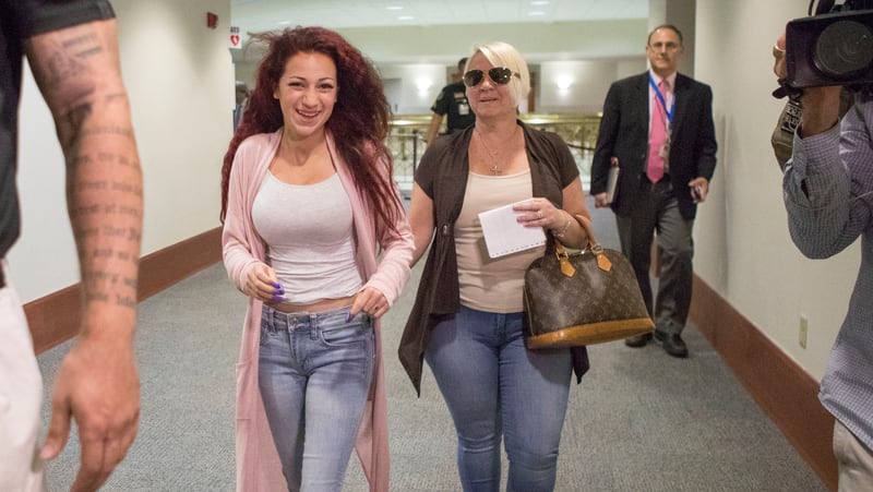 Danielle Bregoli, 14, the Boynton Beach teen who gained notoriety with her catch-phrase “Cash me ousside”, leaves juvenile court in Delray Beachon Wednesday, April 26, 2017 with her mother Barbara Ann Bregoli. The teen pleaded not guilty to several theft charges and a charge of filing a false police report. The judge set a trail date for June 28. 