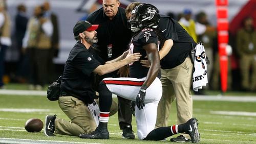 Atlanta Falcons outside linebacker De'Vondre Campbell is helped after being injured against the San Francisco 49ers during the first half Sunday, Dec. 18, 2016, in Atlanta.