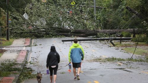 Trees downed by Tropical Storm Irma like this one on Memorial Drive in DeKalb County on Tuesday caused countywide power outages that last four days later.