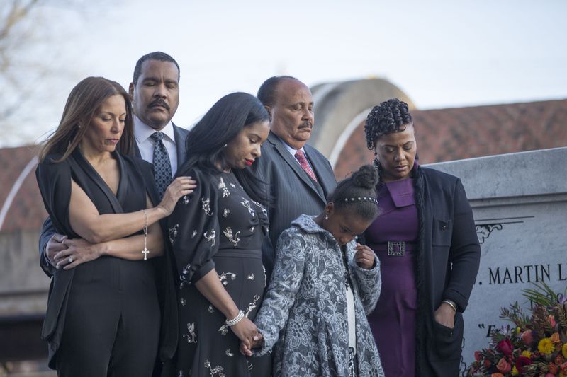 Dexter King, Martin Luther King III and Bernice King are joined by their families as they lay a wreath at their parents' crypt Wednesday evening. ALYSSA POINTER/ALYSSA.POINTER@AJC.COM