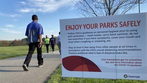 Gwinnett residents exercised on a path at Alexander Park in Lawrenceville on Friday evening, March 27, 2020. Gwinnett County and its 16 cities issued a stay-at-home order for residents that went into effect at 12:01 a.m. Saturday. (Hyosub Shin / Hyosub.Shin@ajc.com) AJC FILE PHOTO