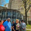 Jonia Milburn (center) speaks in front of the DeKalb County Jail, where her son Christon Collins suffered a medical emergency March 13 and was pronounced dead two days later.