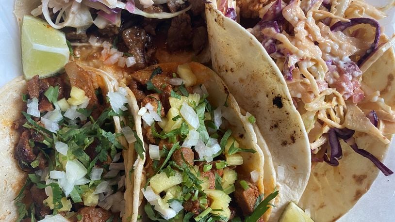 This takeout order includes Taco Cantina’s regular al pastor, super fried chicken and super Asian beef tacos. Bob Townsend for The Atlanta Journal-Constitution