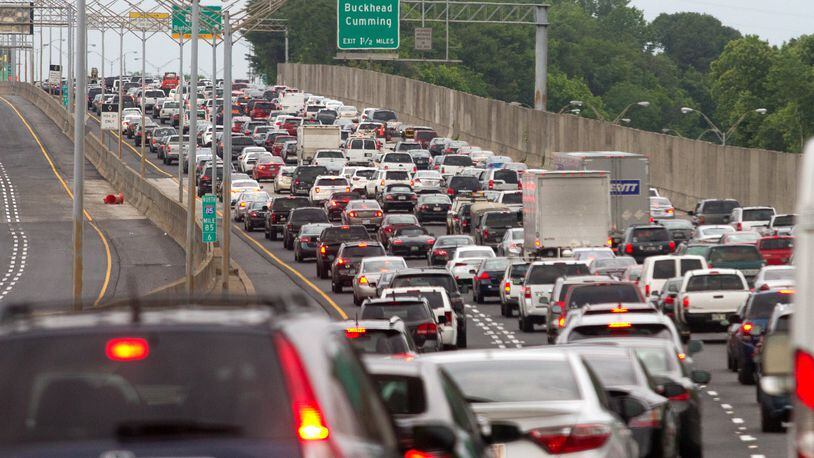 Cars backed up as the Georgia Department of Transportation reopened the northbound lanes of the rebuilt portion of I-85 in Atlanta on Friday evening, May 12, 2017. STEVE SCHAEFER / SPECIAL TO THE AJC