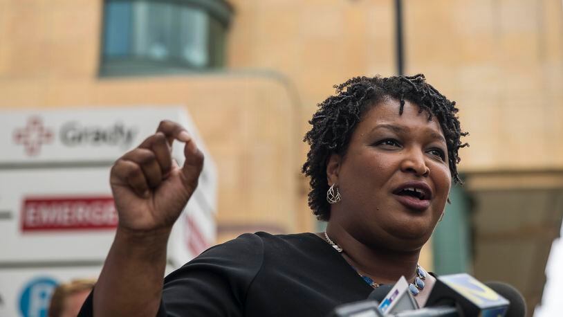 Democratic nominee for governor Stacey Abrams offers details of her health care plan outside Grady Memorial Hospital in Atlanta on Monday. ALYSSA POINTER/ALYSSA.POINTER@AJC.COM