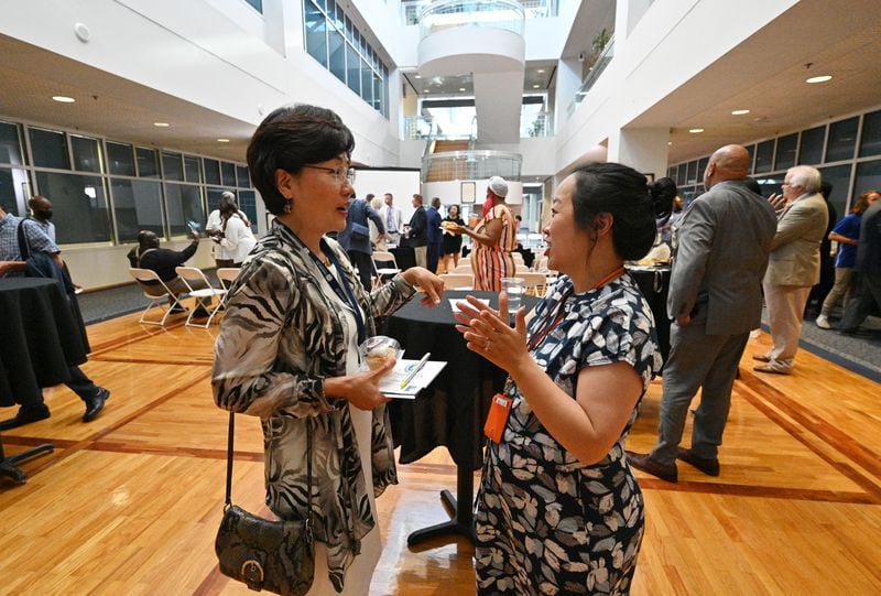 Myeong Hwa Jang, left, talks with Sarah Park, Community Engagement Coordinator, after Gwinnett 101 Citizens Academy's Spring 2021 graduation ceremony. Jang, who moved to Gwinnett last year,  immediately set out to be part of the community, and encouraged her neighbors to vote in the 2020 election. (Hyosub Shin / Hyosub.Shin@ajc.com)