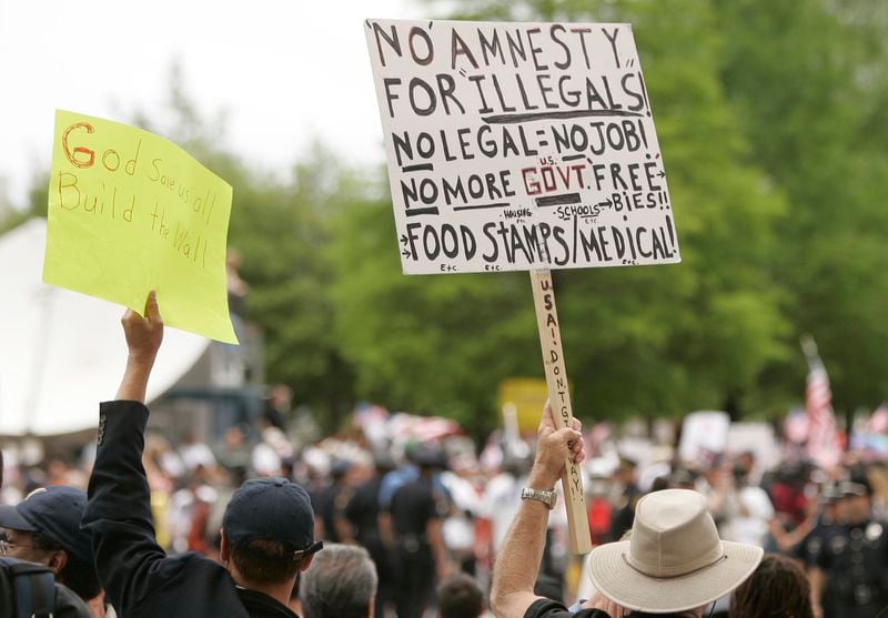 The issue of illegal immigrants and college attendance divides states. (AP Photo/Mike Fuentes)