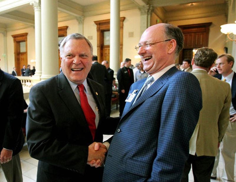 Former Gov. Nathan Deal laughs with Jay Morgan (right) at the State Capitol. (Jason Getz / The Atlanta Journal-Constitution)