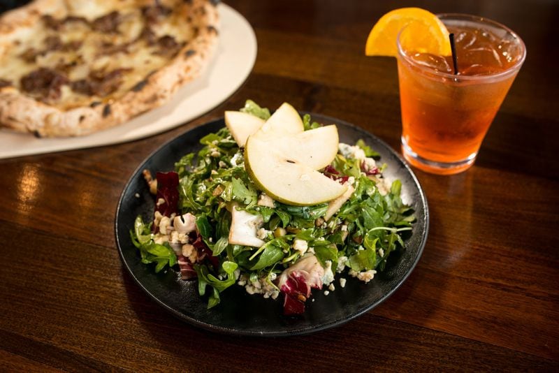  Pear and Gorgonzola Salad with arugula, radicchio, pecans, and honey balsamic vinaigrette. Photo credit- Mia Yakel.