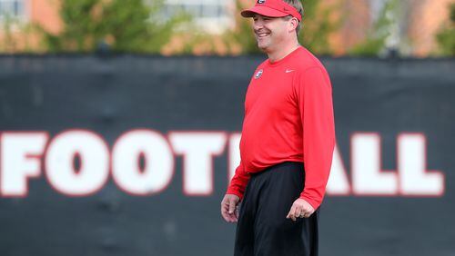 March 21, 2017, Athens: Georgia head football coach Kirby Smart manages a smile while taking the field to watch over the first day of spring football practice at the University of Georgia on Tuesday, March 21, 2017, in Athens.   Curtis Compton/ccompton@ajc.com