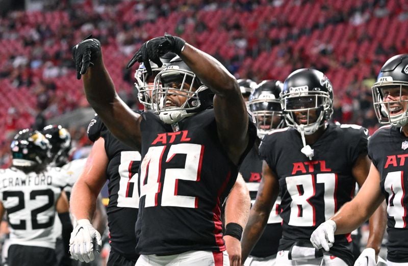 August 2 , 2022 Atlanta - Atlanta Falcons' running back Caleb Huntley (42) celebrates after scoring a touchdown during the second half of the final exhibition game of the preseason at Mercedes-Benz Stadium in Atlanta at on Saturday, August 27, 2022. Atlanta Falcons won 28-12 over Jacksonville Jaguars. (Hyosub Shin / Hyosub.Shin@ajc.com)