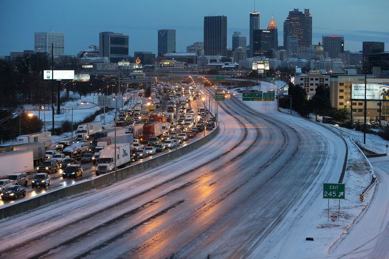 Snowstorms in 2014 forced state and local governments to hire contractors to treat roads and interstates. BEN GRAY / BGRAY@AJC.COM