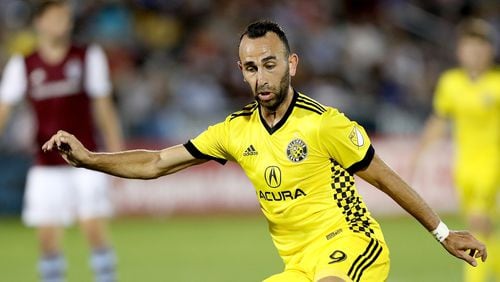 Justin Meram of the Columbus Crew SC kicks a shot on goal against the Colorado Rapids June 3, 2017, at Dick's Sporting Goods Park in Commerce City, Colo.