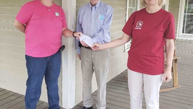 Julian Hardegree of the Union City Elks Lodge presented a grant check to Fayette Humane Society officers Stephanie Cohran and Sharon Marchisello. Courtesy FHS