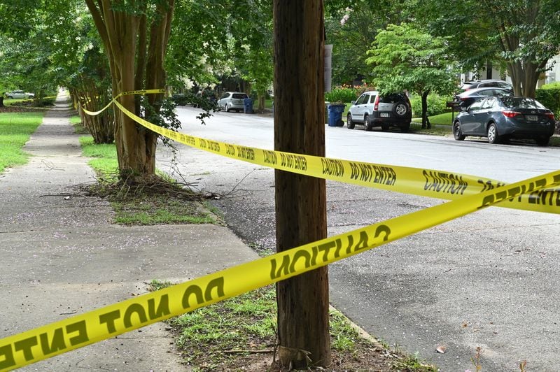 Police tape helps warn people away on Tuesday, July 7, 2020, from an area between Atlanta Avenue and Ormond Street near Greenfield Street that was contaminated with sewage in Peoplestown during recent flooding. HYOSUB SHIN / HYOSUB.SHIN@AJC.COM