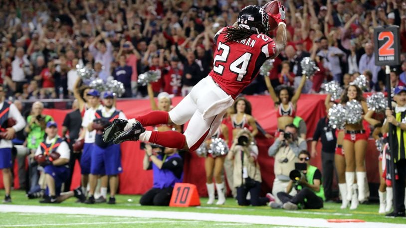 FEBRUARY 5, 2017 HOUSTON TX Atlanta Falcons running back Devonta Freeman (24) dives into the end zone for a score in the first quarter as the Atlanta Falcons meet the New England Patriots in Super Bowl LI at NRG Stadium in Houston, TX, Sunday, February 5, 2017. Curtis Compton/AJC