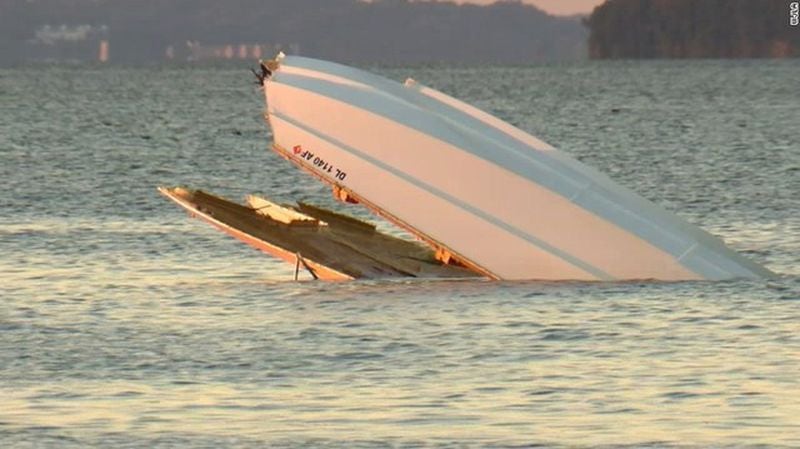 James A. Melley, 49, of Buford, and Garth Thomas Tagge, 61, of Atlanta, were thrown when their 36-foot catamaran flipped in the water about noon. (Credit: Channel 2 Action News)