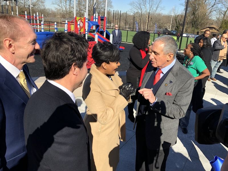 Atlanta Super Bowl Host Committee officials Brett Daniels, left, Dan Corso, Mayor Keisha Lance Bottoms and Falcons owner Arthur Blank talk at the re-opening celebration of John F. Kennedy Park. NFL Commissioner Roger Goodell, Blank and Bottoms helped commemorate the re-opening of the park, which underwent a five-month renovation as part of a gift from the NFL Foundation and the Atlanta Super Bowl Host Committee. J. SCOTT TRUBEY/STRUBEY@AJC.com