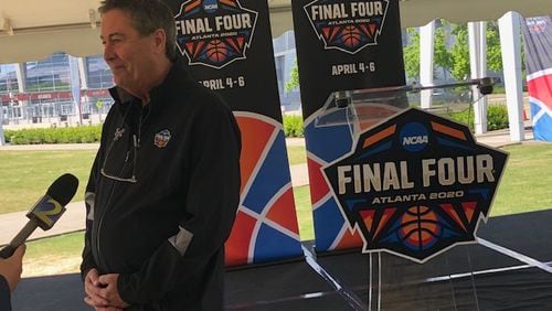 Carl  Adkins, executive director of the Atlanta Basketball Host Committee, answers questions after a Final Four news conference outside Mercedes-Benz Stadium on Wednesday.